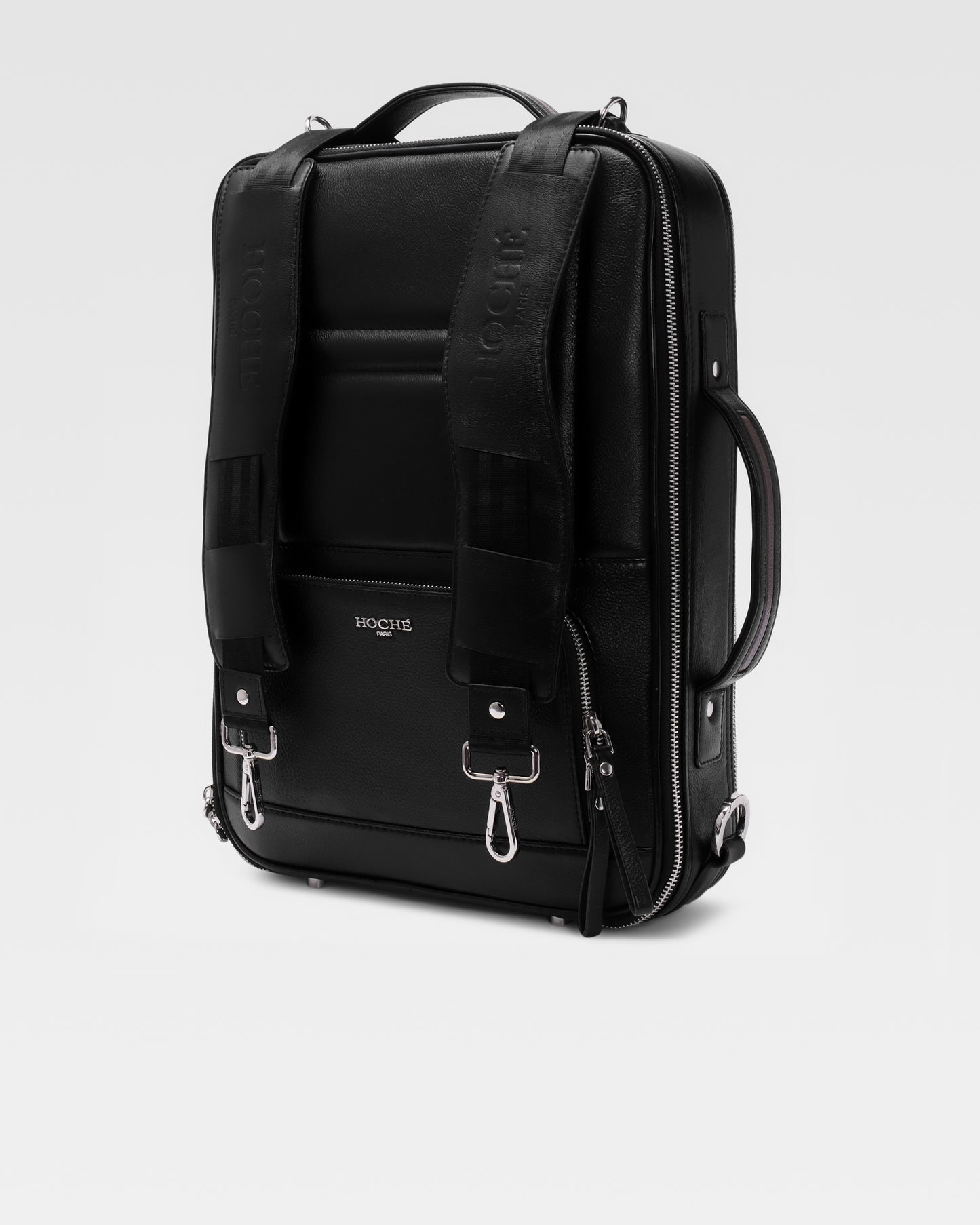 Side profile of UniSwitch black genuine leather laptop backpack for men in India, showcasing its convertible 3-in-1 design for professionals.