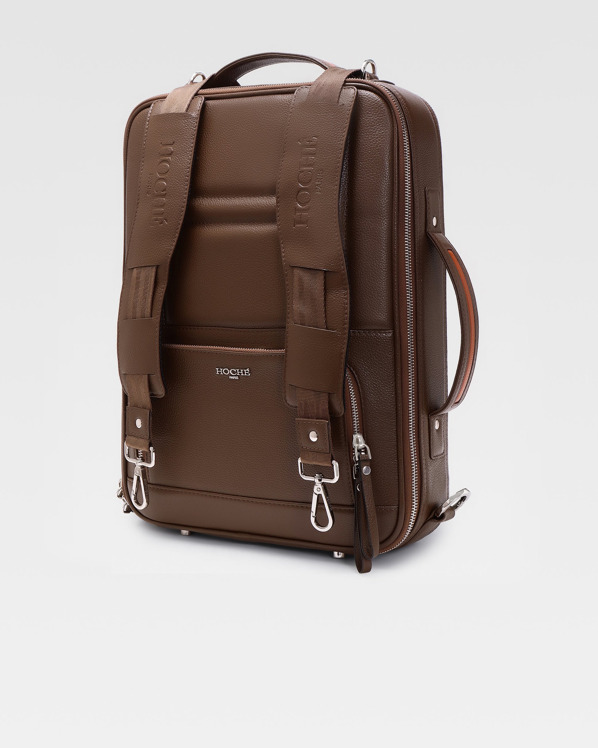 Side profile of UniSwitch dark brown genuine leather laptop backpack for men in India, showcasing its convertible 3-in-1 design for professionals.