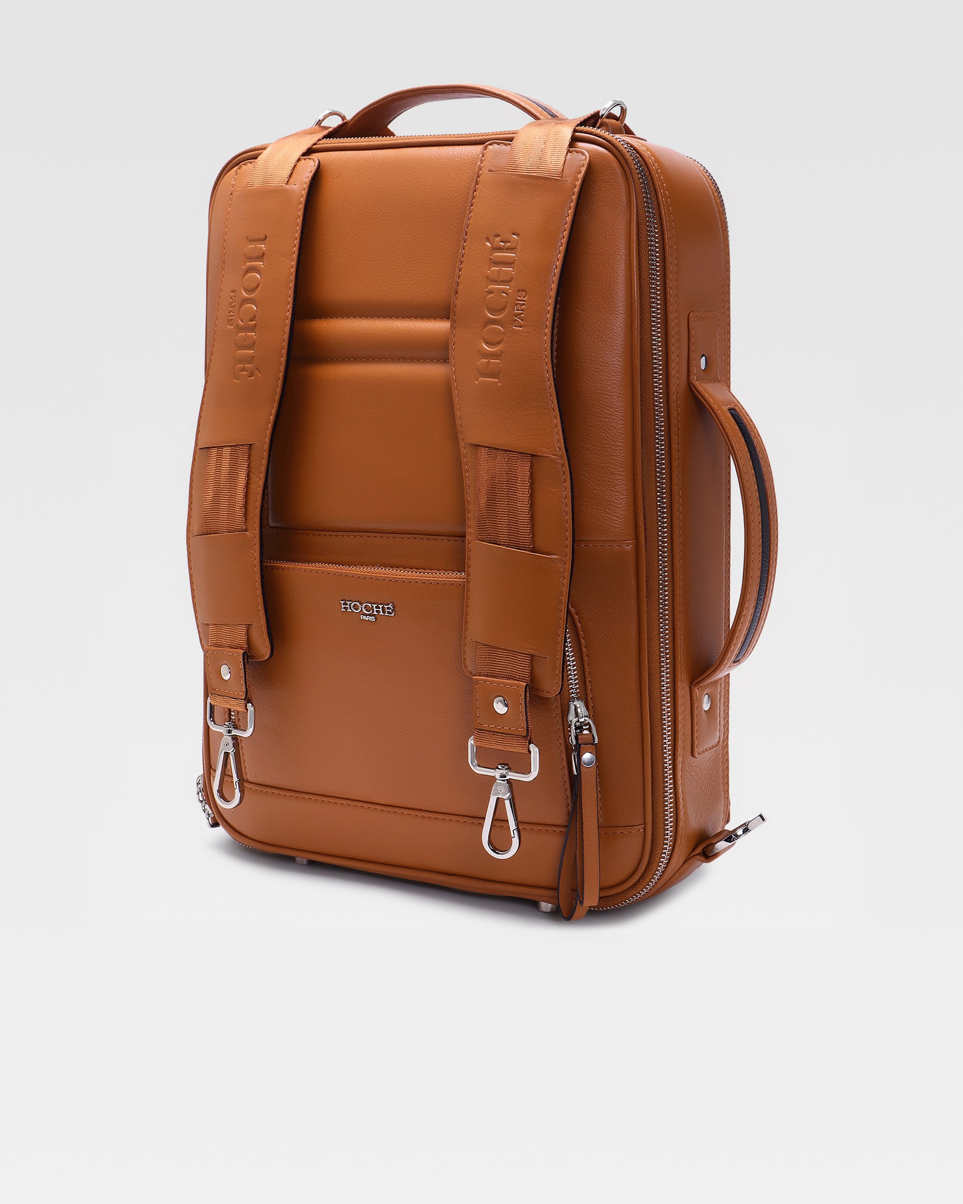 Side profile of UniSwitch tan genuine leather laptop backpack for men in India, showcasing its convertible 3-in-1 design for professionals.