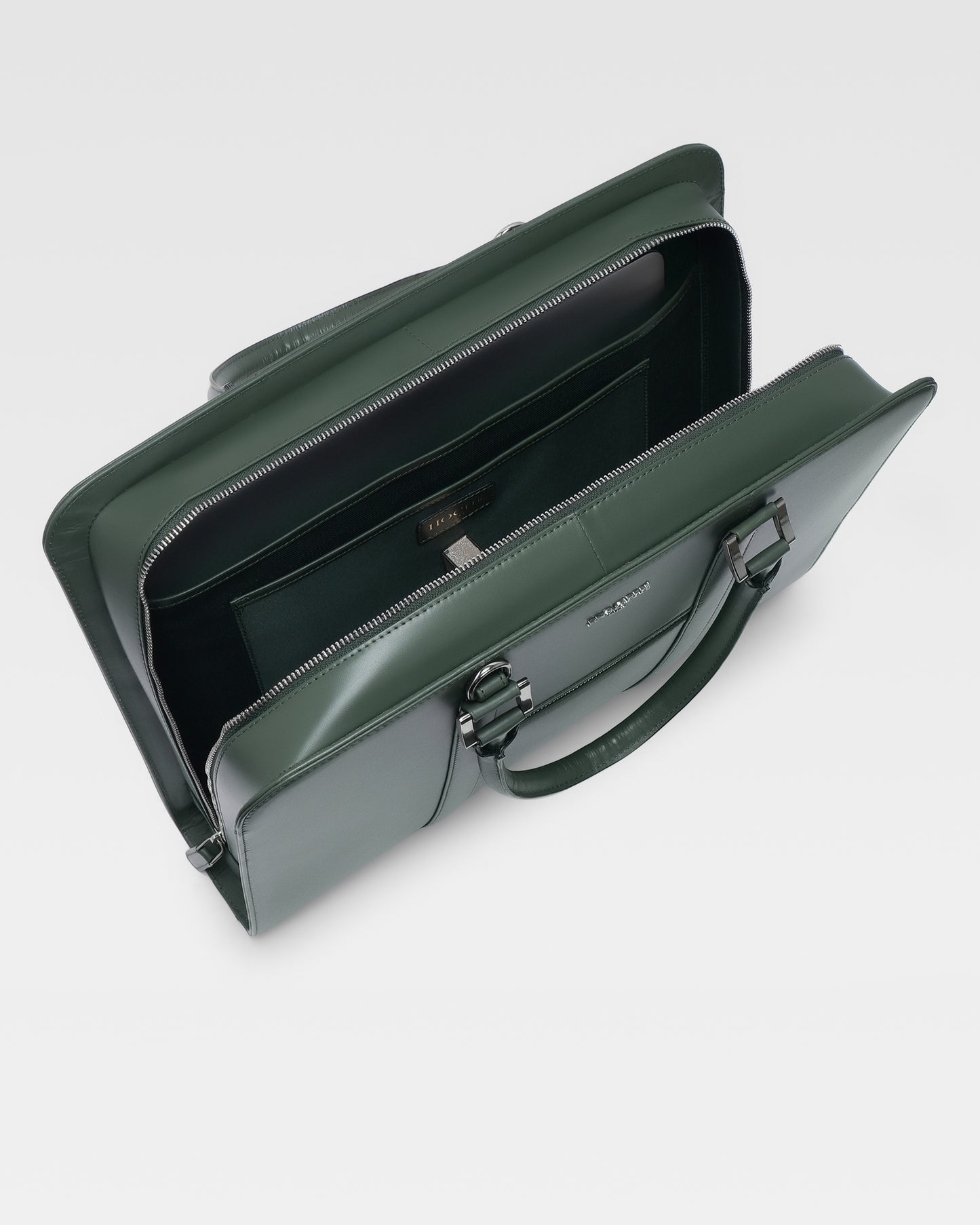 Open view of PinnaclePro dark green pure leather laptop bag, showcasing a spacious interior, padded laptop compartment, and multiple organizers for office and travel