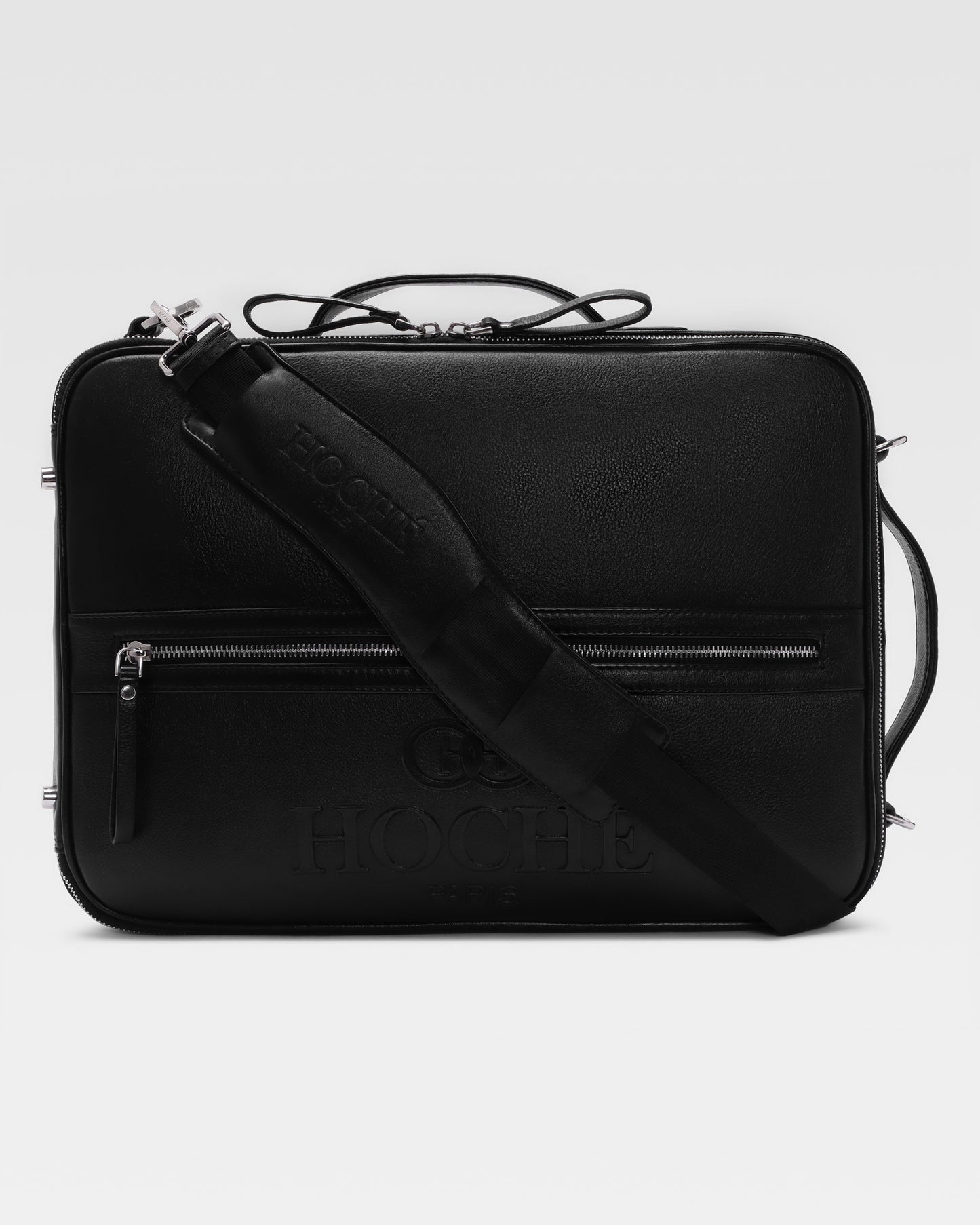 Briefcase view of UniSwitch black branded genuine leather 3 in 1 convertible genuine leather backpack for men in India, featuring ergonomic padded straps and a hidden trolley sleeve.
