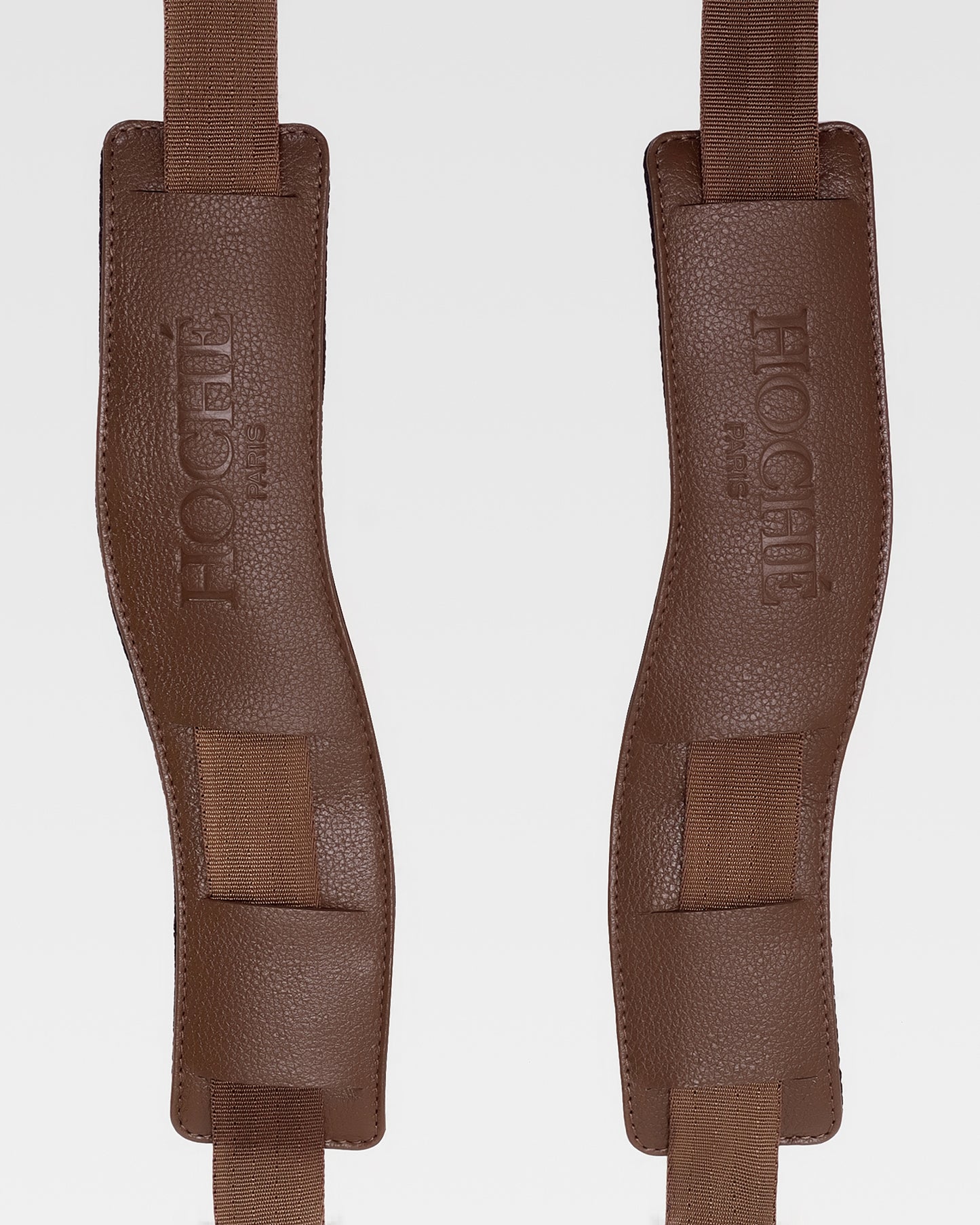 Close-up of UniSwitch dark brown genuine leather backpack for men in India, highlighting premium craftsmanship, and Hoche paris embossed logo