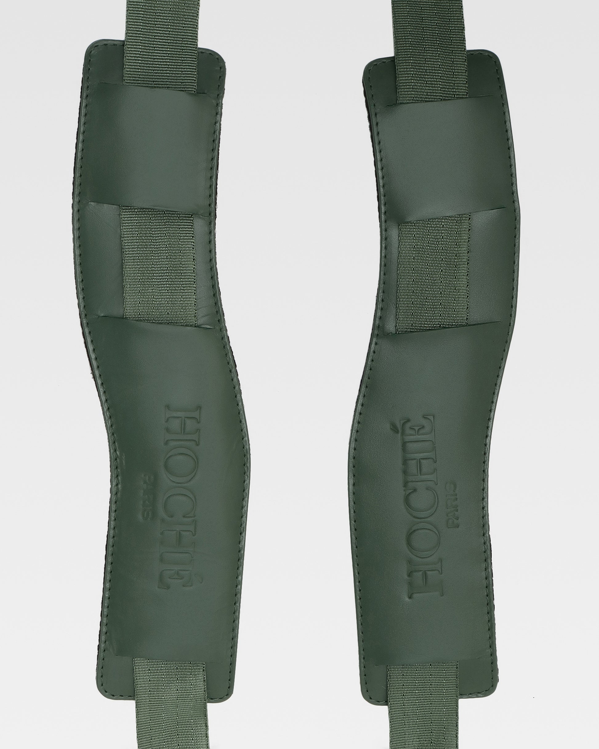 Close-up of UniSwitch olive green genuine leather backpack for men in India, highlighting premium craftsmanship, and Hoche paris embossed logo