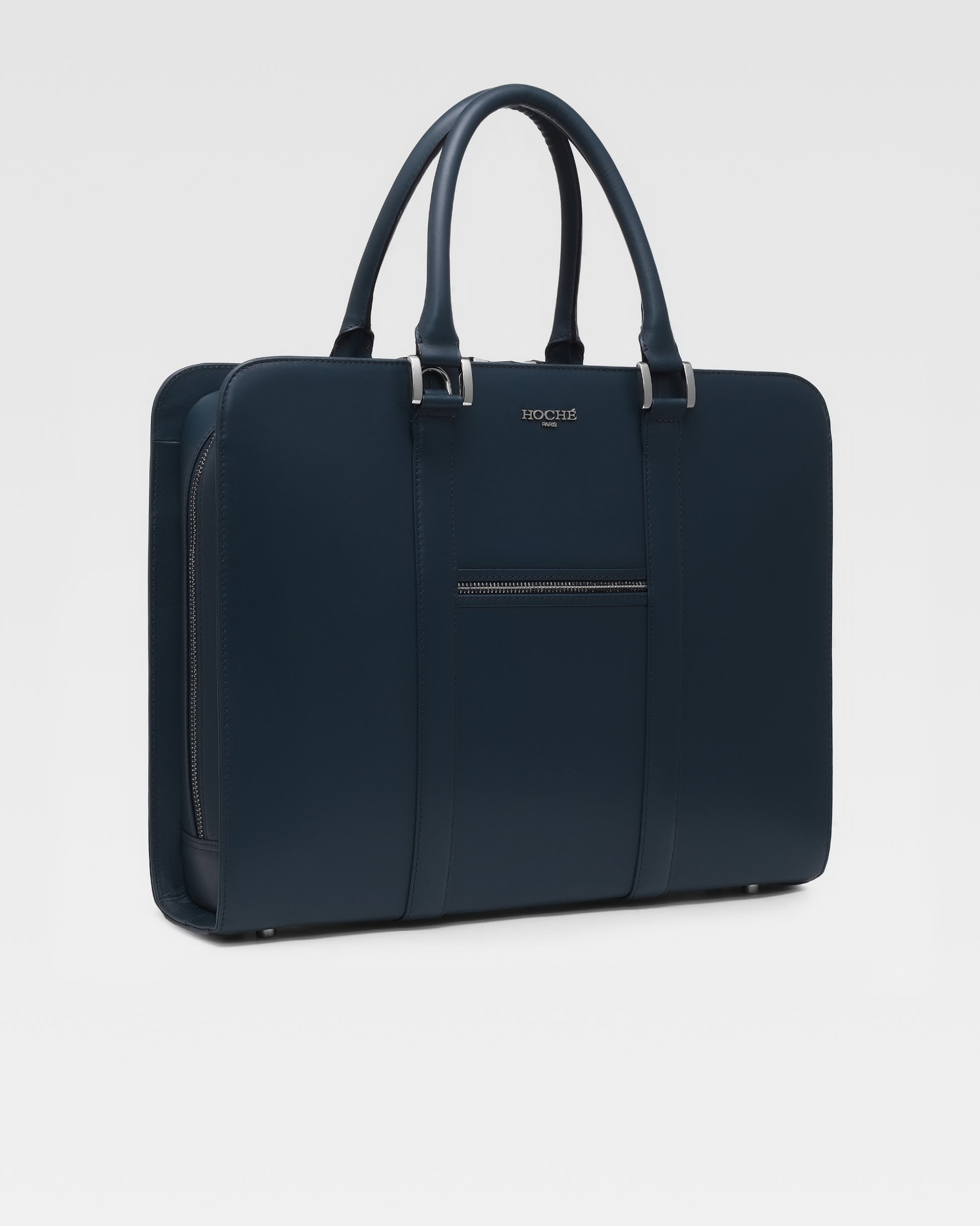 Side profile of PinnaclePro dark blue leather laptop bag for men, showcasing its slim, structured design and high-quality craftsmanship