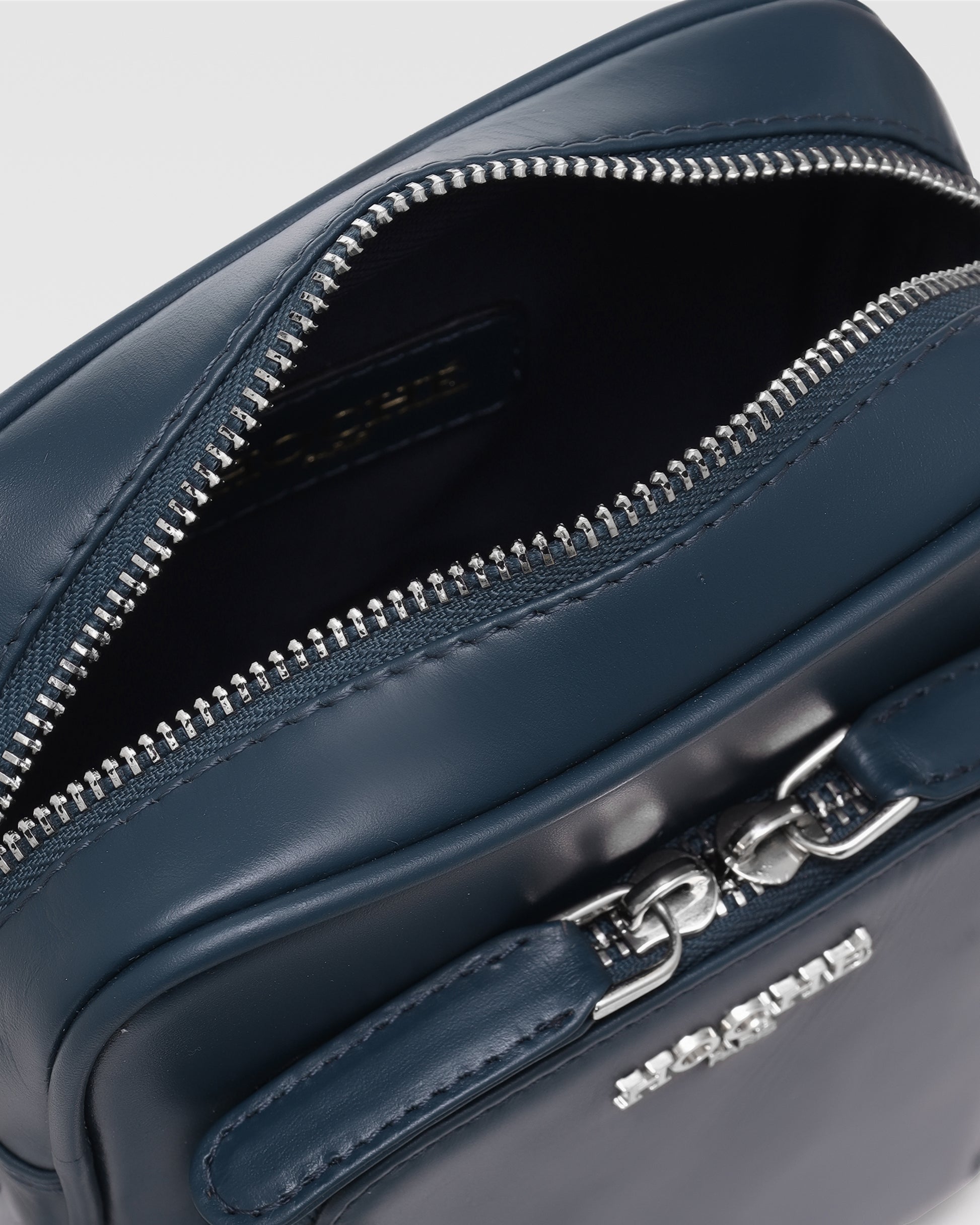 Close-up of Dark Blue genuine leather on men’s sling bag – Grandeur by Hoche Paris