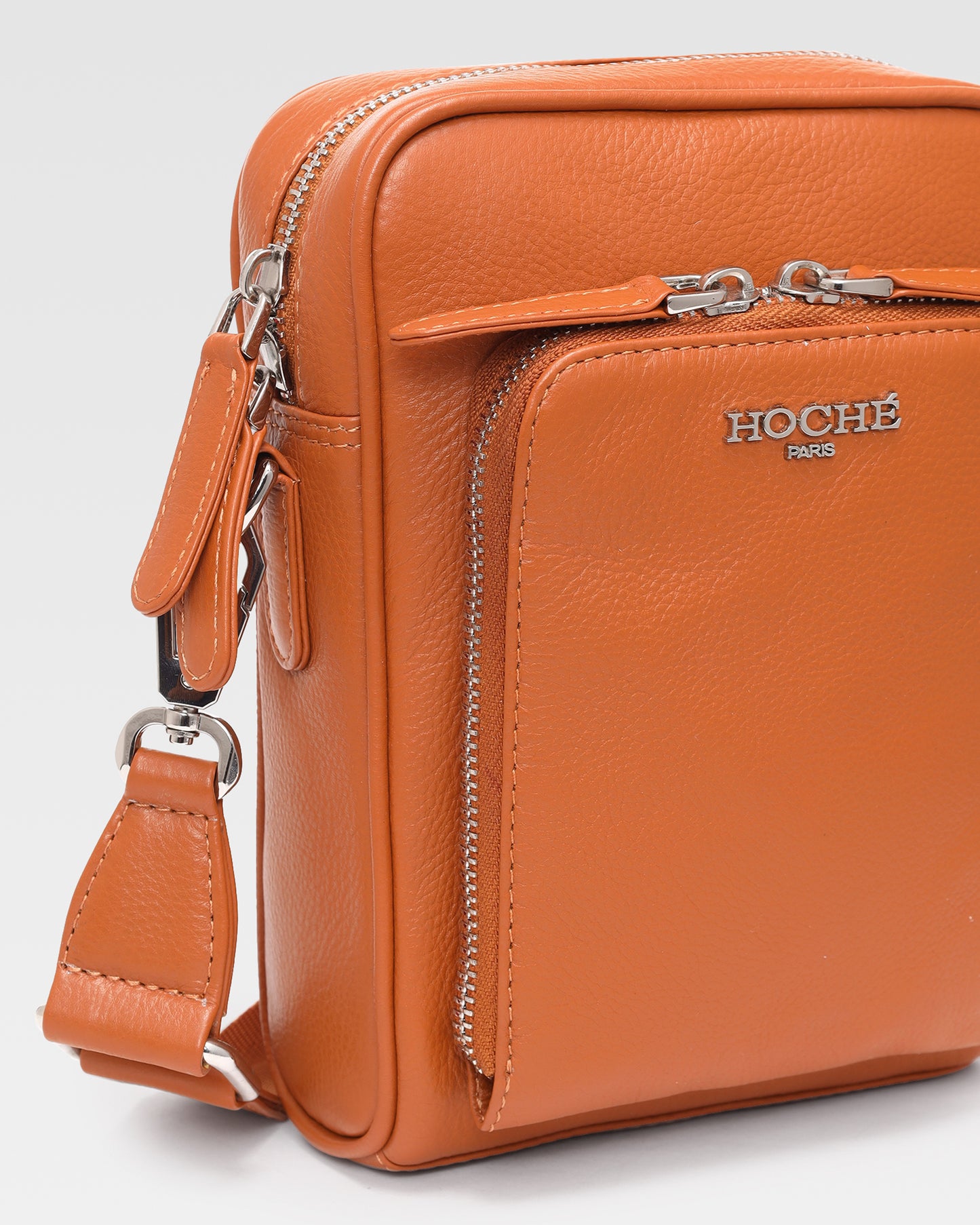 Close-up of Umber Tan genuine leather on men’s sling bag – Grandeur by Hoche Paris