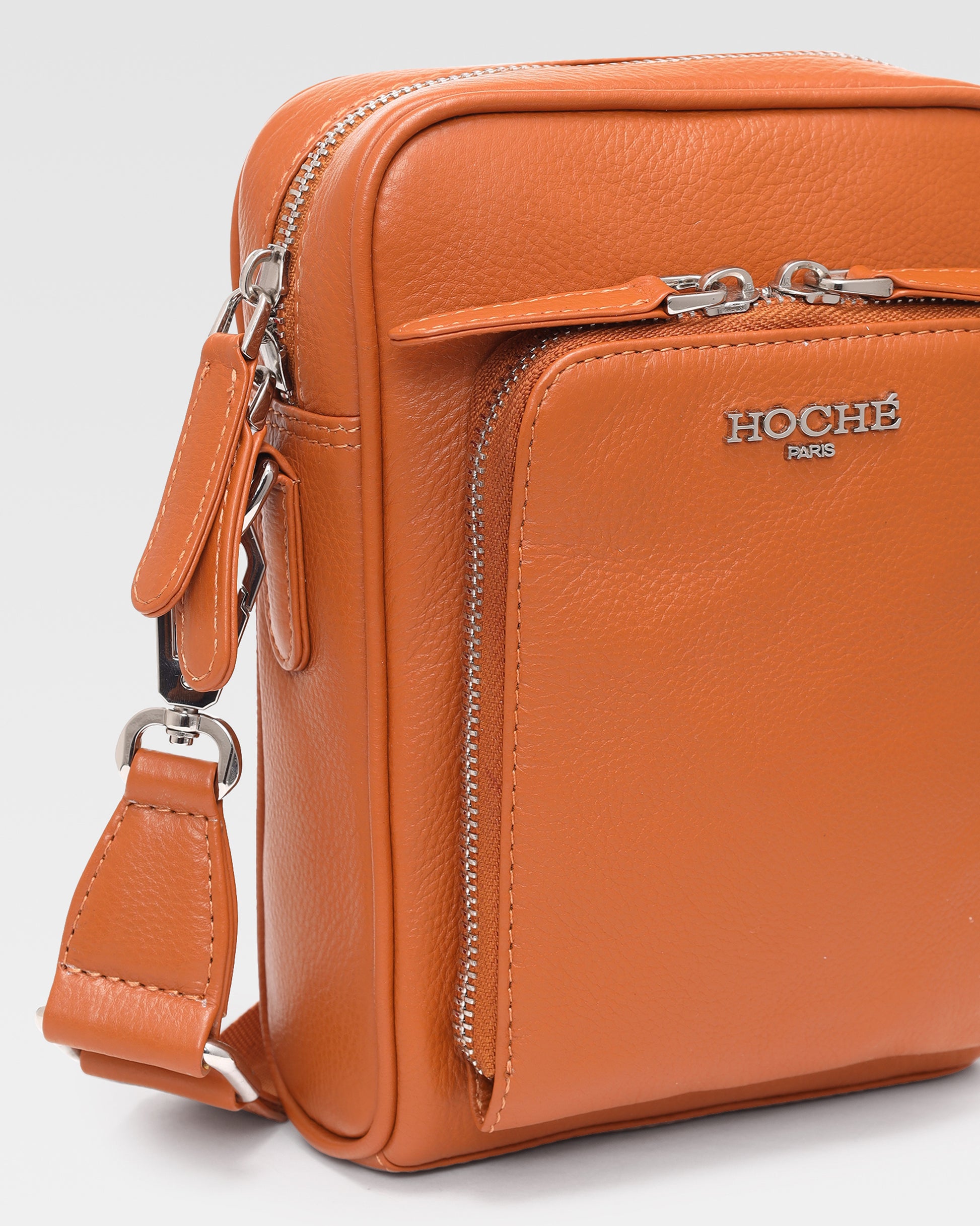 Close-up of Umber Tan genuine leather on men’s sling bag – Grandeur by Hoche Paris
