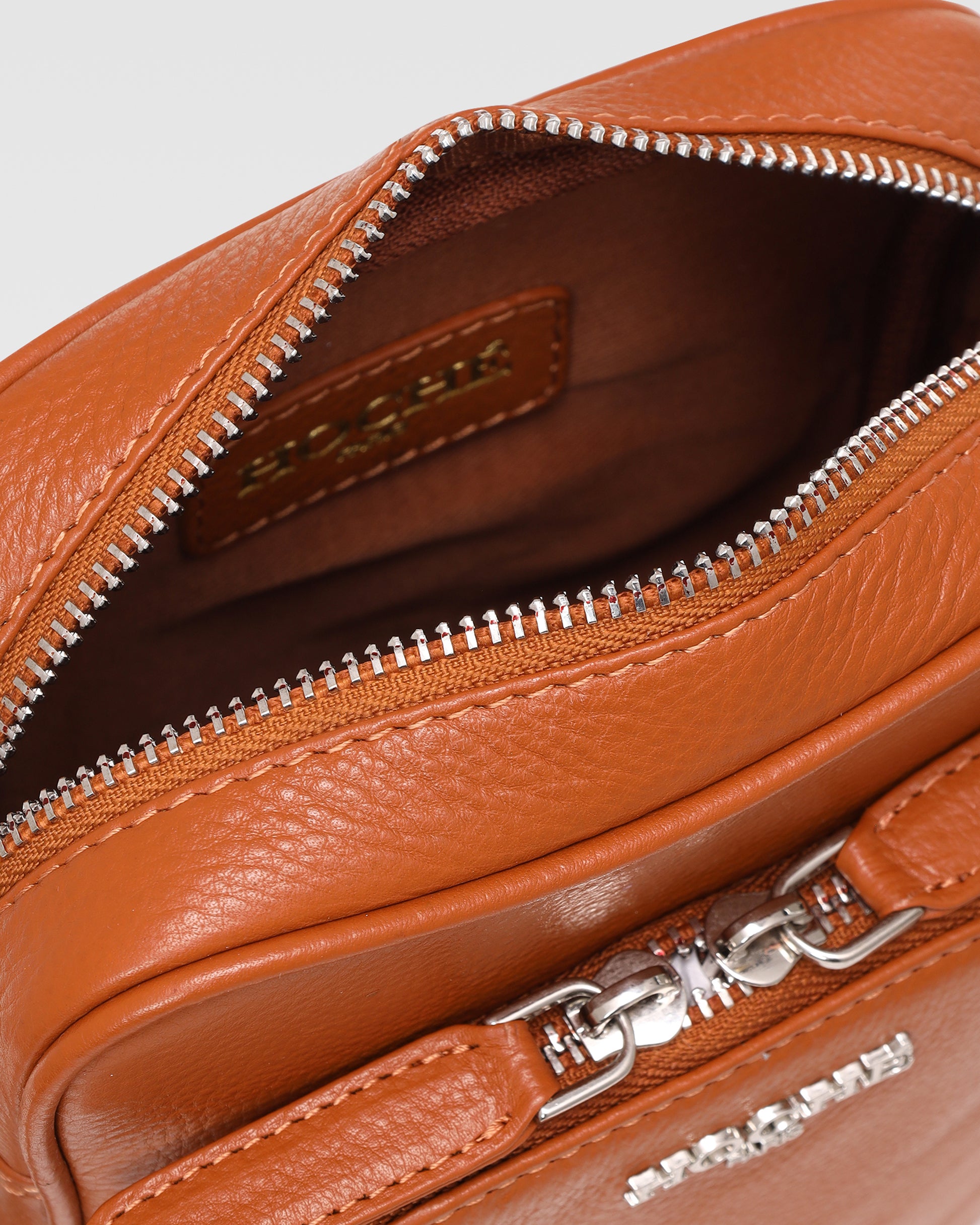Close-up of Umber Tan genuine leather on men’s sling bag – Grandeur by Hoche Paris