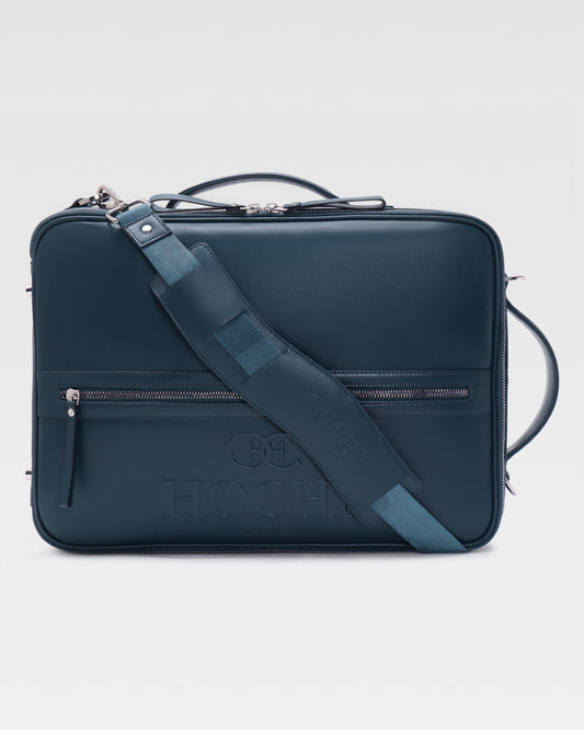 Briefcase view of UniSwitch dark blue branded genuine leather 3 in 1 convertible genuine leather backpack for men in India, featuring ergonomic padded straps and a hidden trolley sleeve.