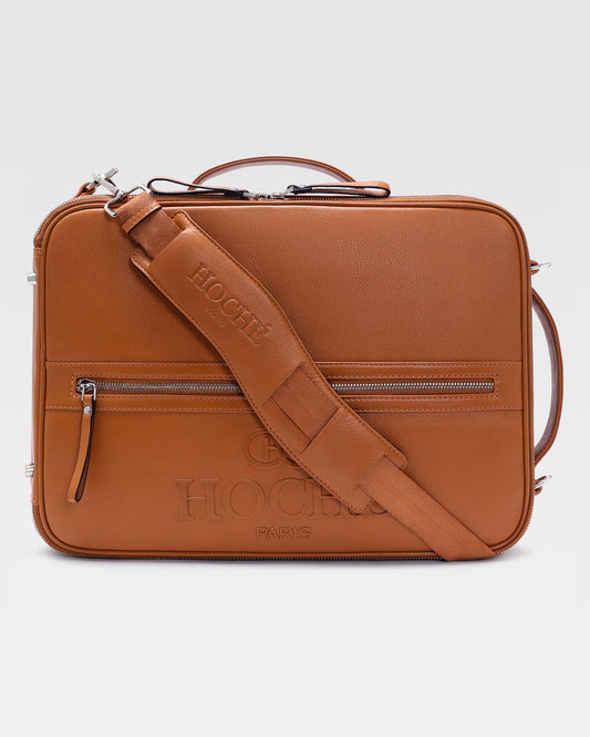 Briefcase view of UniSwitch tan branded genuine leather 3 in 1 convertible genuine leather backpack for men in India, featuring ergonomic padded straps and a hidden trolley sleeve.